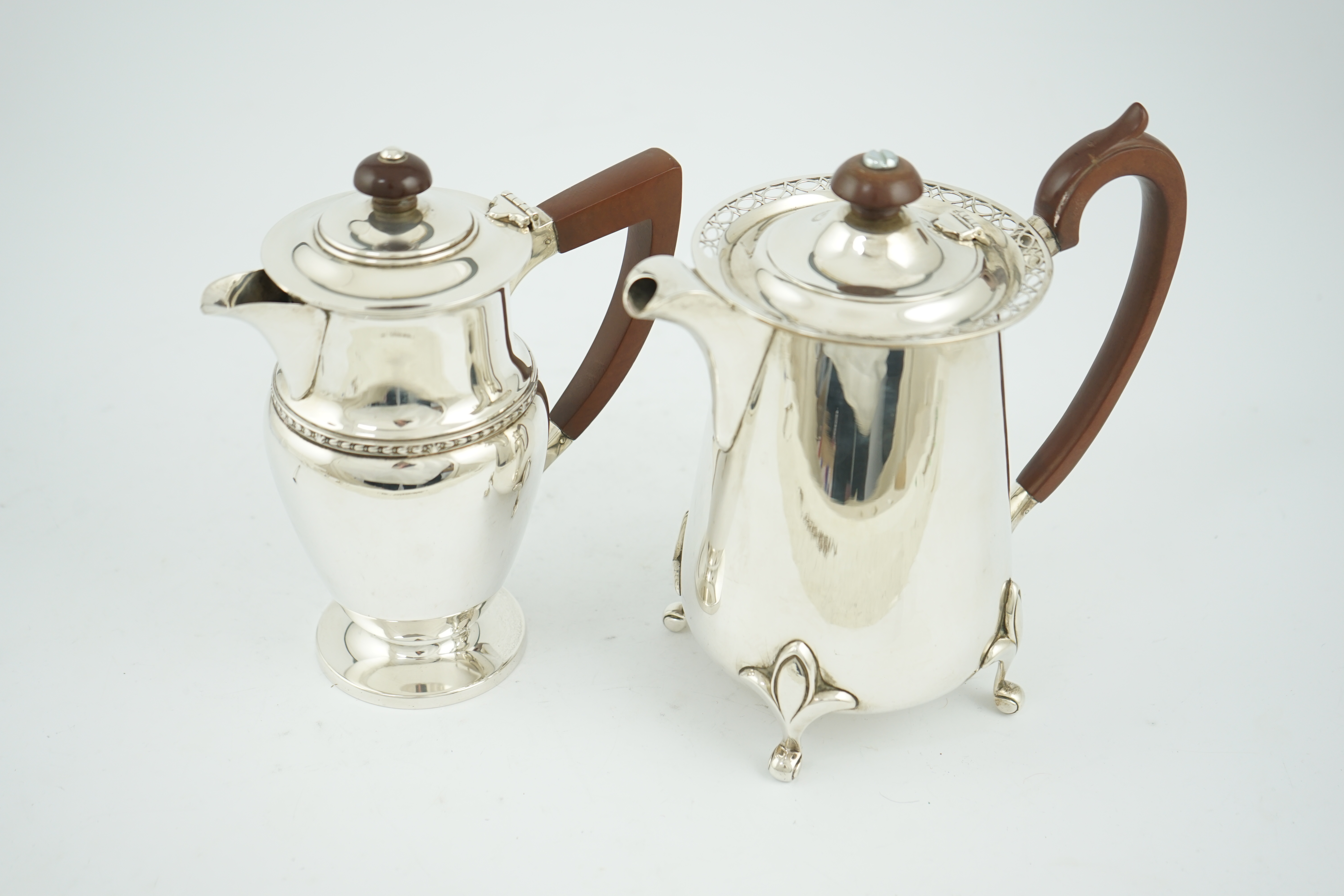 A George V silver hot water pot by Walker & Hall, Sheffield, 1925, and one other silver hot water pot by Albert Edward Jones, Birmingham, Birmingham, 1933